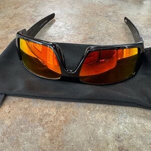 Oakley Wrap Sunglasses with Black Frame and Red-Orange Mirrored Lenses